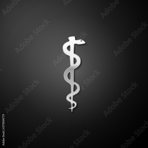 Silver Rod of asclepius snake coiled up silhouette icon isolated on black background. Emblem for drugstore or medicine, pharmacy snake symbol. Long shadow style. Vector.