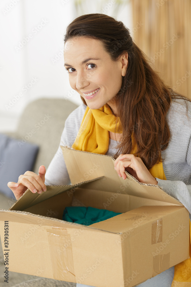 happy asian young woman with parcel box at home happy asian young woman with parcel box at home