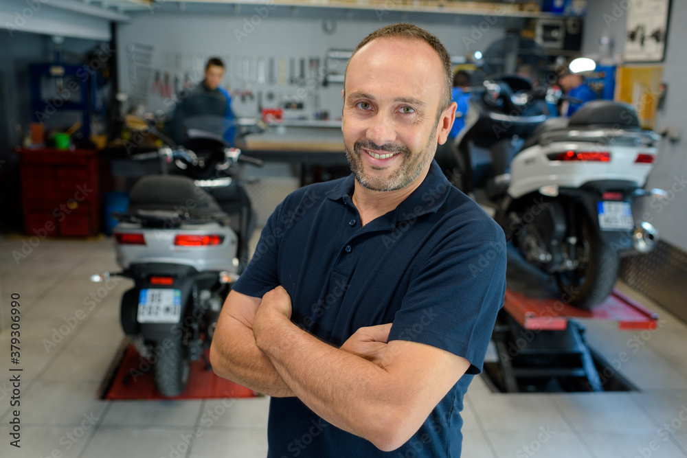 happy mechanic man looking at camera