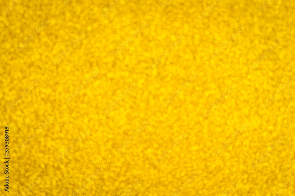 Defocused abstract bokeh circular reflection of Merry Christmas light on gold background. Eve party winter. Happy new year concept.