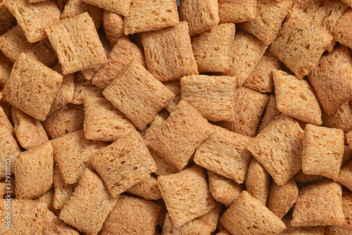 Heap of breakfast cereal pads texture or background