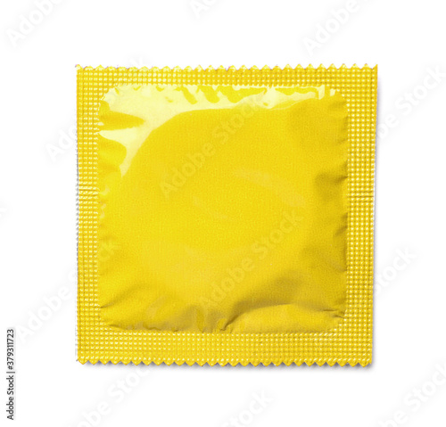 Yellow condom package on white background, top view. Safe sex