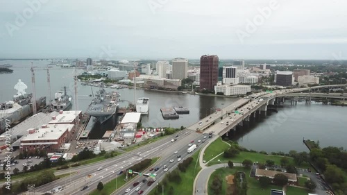 Norfolk Virginia Skyline with Navy Ship in Port in Foreground Aerial in 4k photo