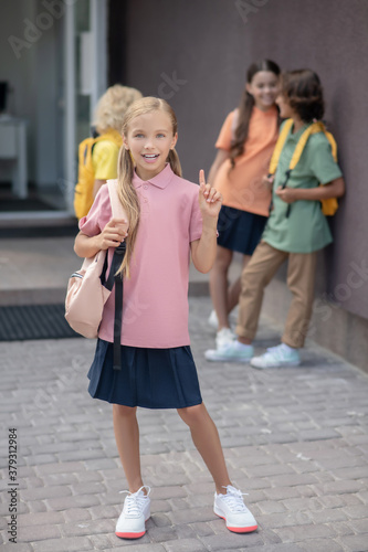 Fototapeta Naklejka Na Ścianę i Meble -  Cute girl in pink tshirt smiling and looking good