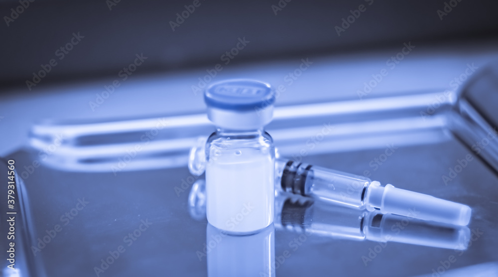 Vaccine coronavirus deverlopment vial dose flu shot drug needle syringe,medical concept vaccination hypodermic injection treatment disease care hospital prevention immunization illness disease. Vaccine coronavirus deverlopment vial dose flu shot drug needle syringe,medical concept vaccination hypodermic injection treatment disease care hospital prevention immunization illness disease.
