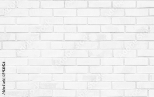 White brick wall texture background in room at subway. Brickwork stonework interior, rock old concrete grid uneven abstract weathered grey clean tile design, horizontal architecture wallpaper.
