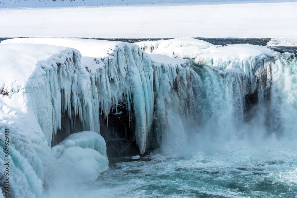 Scenic winter view of Godafoss waterfall in Iceland. Picturesque winter landscape with frozen waterfall in Iceland. Scenic winter view of Godafoss waterfall in Iceland. Picturesque winter landscape with frozen waterfall in Iceland.