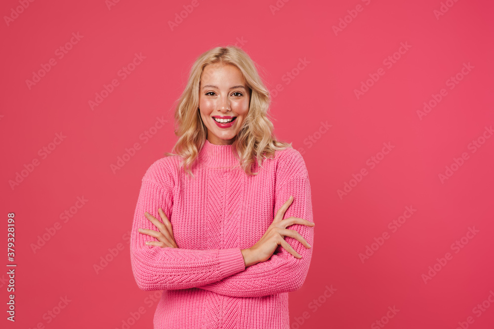 Image of happy blonde woman smiling and looking at camera Image of happy blonde woman smiling and looking at camera