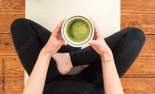 Cup of matcha in a meantime during yoga practise