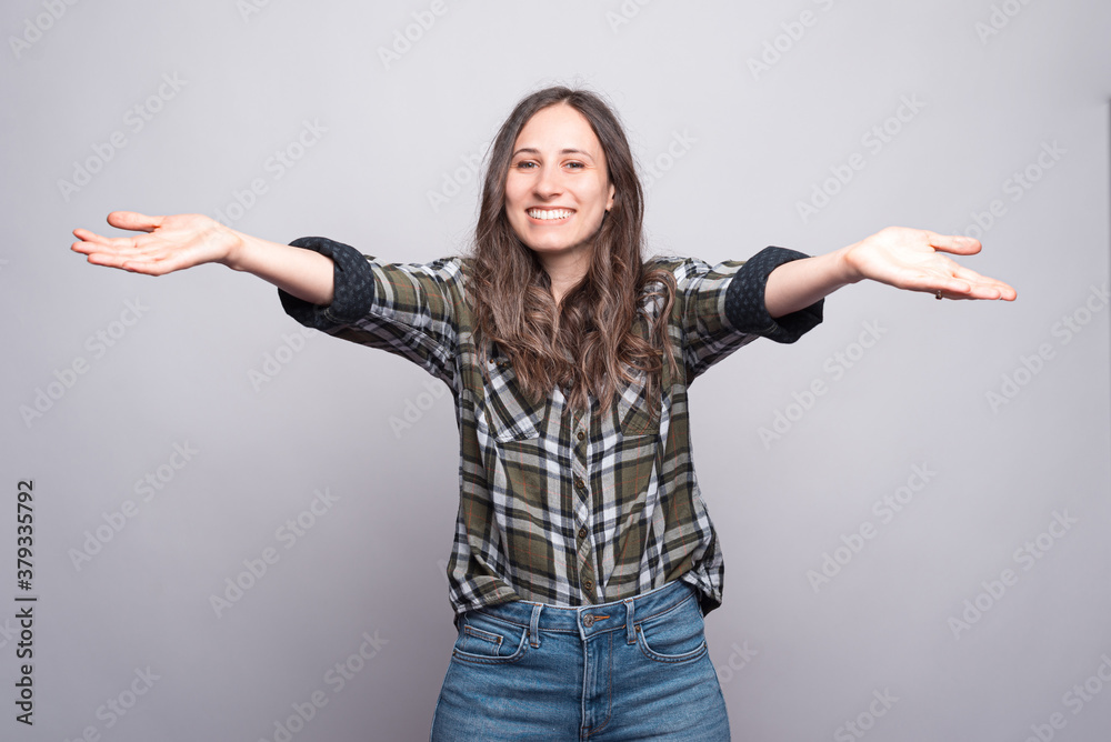 lets hug, a beautiful young female is smiling with both hands up