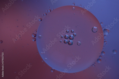 Fantastic oil drops on ble-purple background