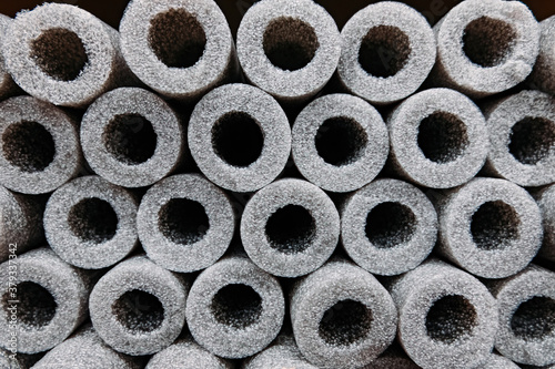 Stacked insulation for pipes of polyethylene foam in warehouse