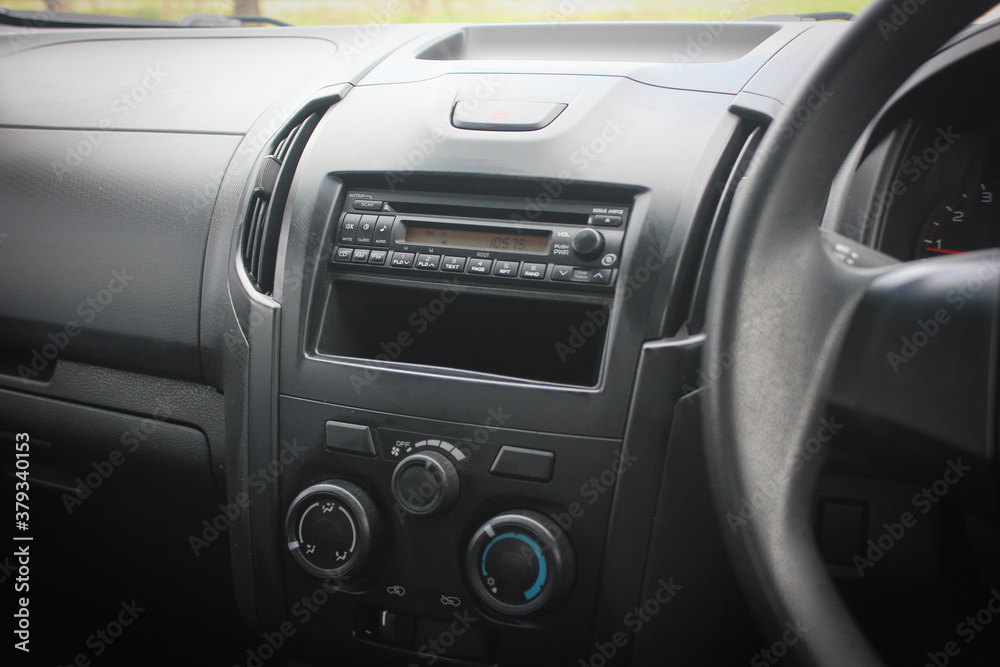 Close up image of car dashboard audio radio air conditioner console. Car audio player. Close up image of car dashboard audio radio air conditioner console. Car audio player.