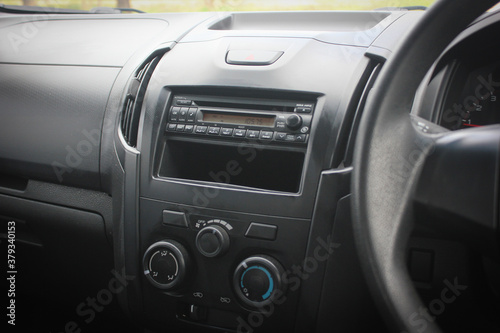 Close up image of car dashboard audio radio air conditioner console. Car audio player.
