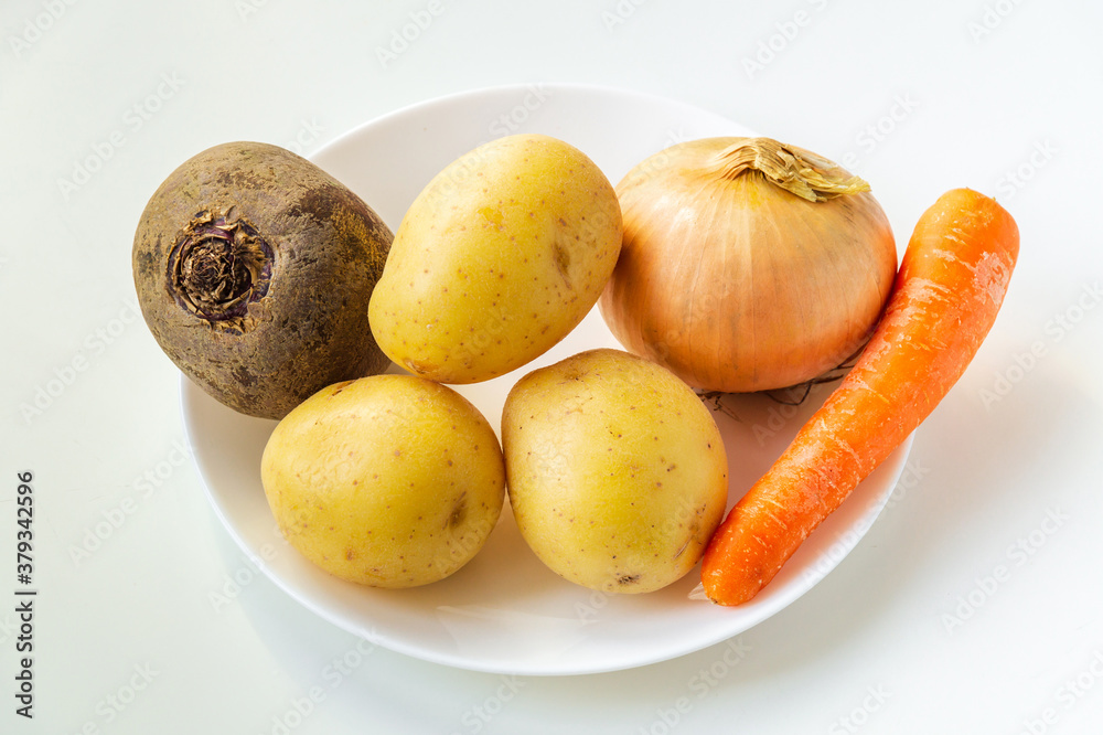 Set of vegetables in bowl for making soup or borscht. Culinary idea for dieting or fasting days Set of vegetables in bowl for making soup or borscht. Culinary idea for dieting or fasting days
