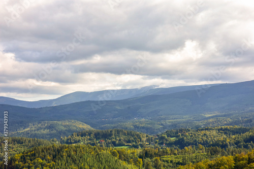 Fototapeta Naklejka Na Ścianę i Meble -  View from above on green fields, forests and mountains in the Karkonosze Mountains of Poland.