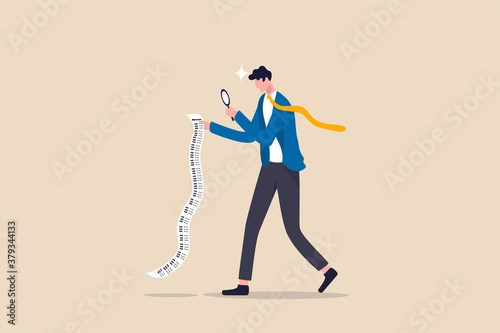 Paying bills, cost and expense analysis for business or personal finance concept, smart businessman using magnifying glass to analyze budget, income tax or expense on long invoice receipt paper. photo