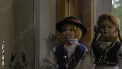 Polish Boy And Girl Vintage Dolls Wearing National Costume In A Shop In Swornegacie, Northern Poland - Closeup Pan Left Shot photo