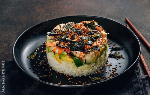 Spicy shrimp sushi stacks with layers of sushi rice, cucumbers and avocado spicy shrimp and furikake