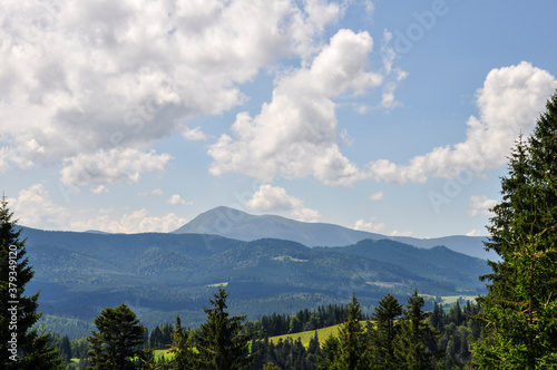 beautiful mountain landscape with colorful bright clouds and sunshine in the sky, fantastic outdoor background