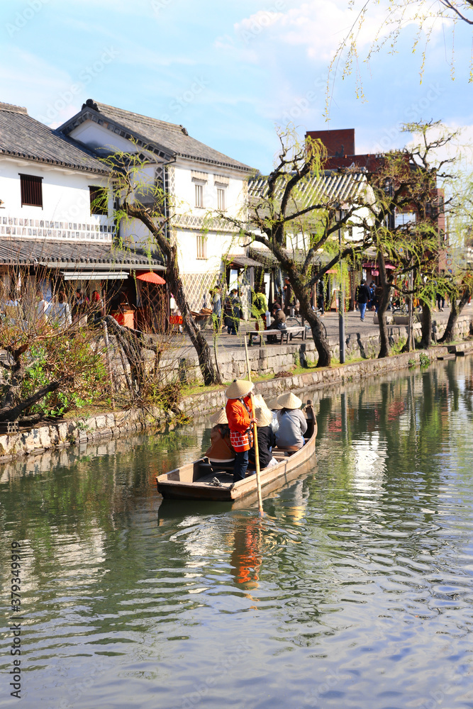 People in old-fashioned boat, Kurashiki city, Japan