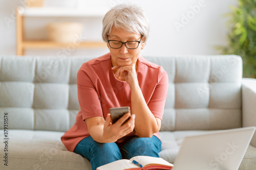 senior woman is using smartphone