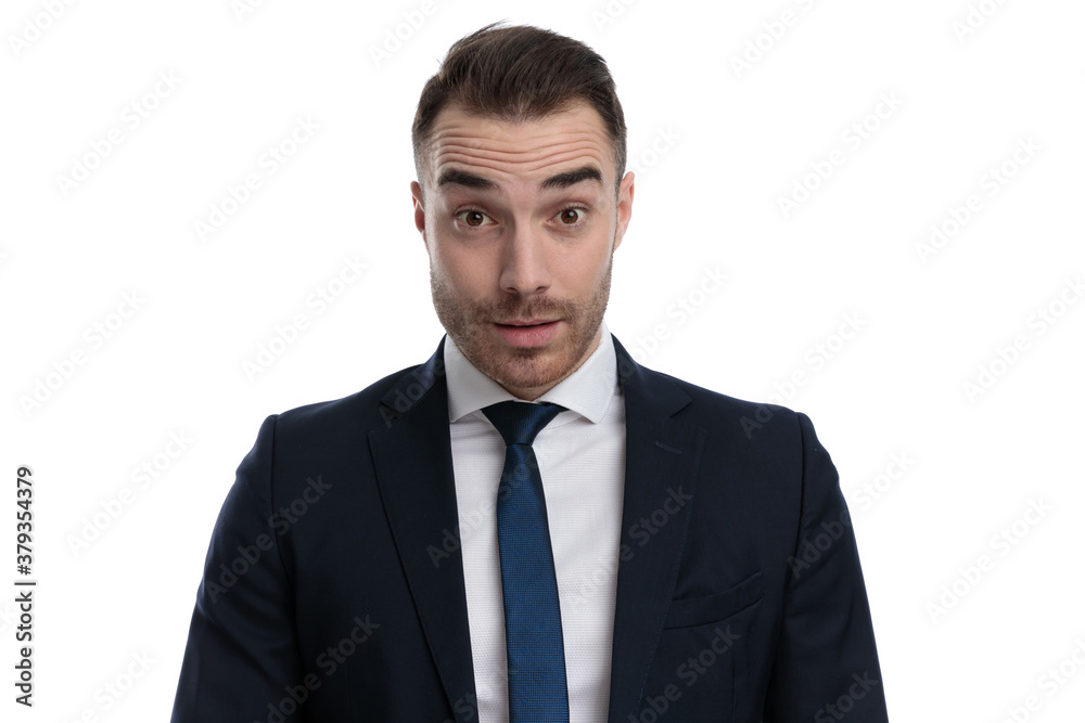 Speechless businessman looking forward while standing Speechless businessman looking forward while standing