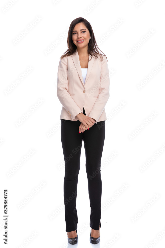Attractive businesswoman smiling while standing Attractive businesswoman smiling while standing