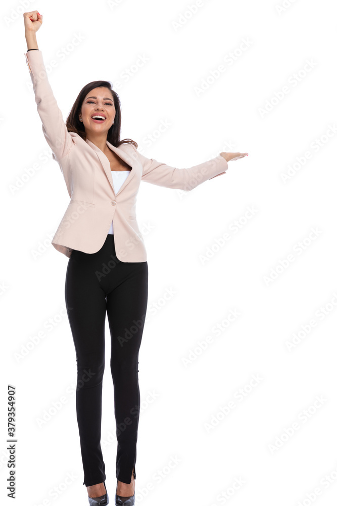 Cheerful businesswoman celebrating and presenting, laughing Cheerful businesswoman celebrating and presenting, laughing