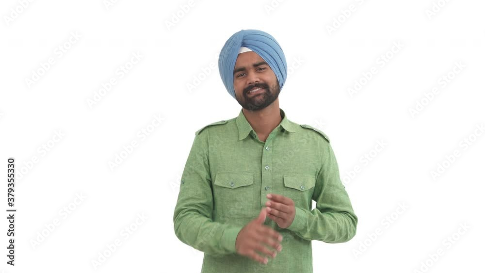 Beard Indian man rubbing hands expressing feeling of excited expectation. Body language concept. Isolated on white background Beard Indian man rubbing hands expressing feeling of excited expectation. Body language concept. Isolated on white background