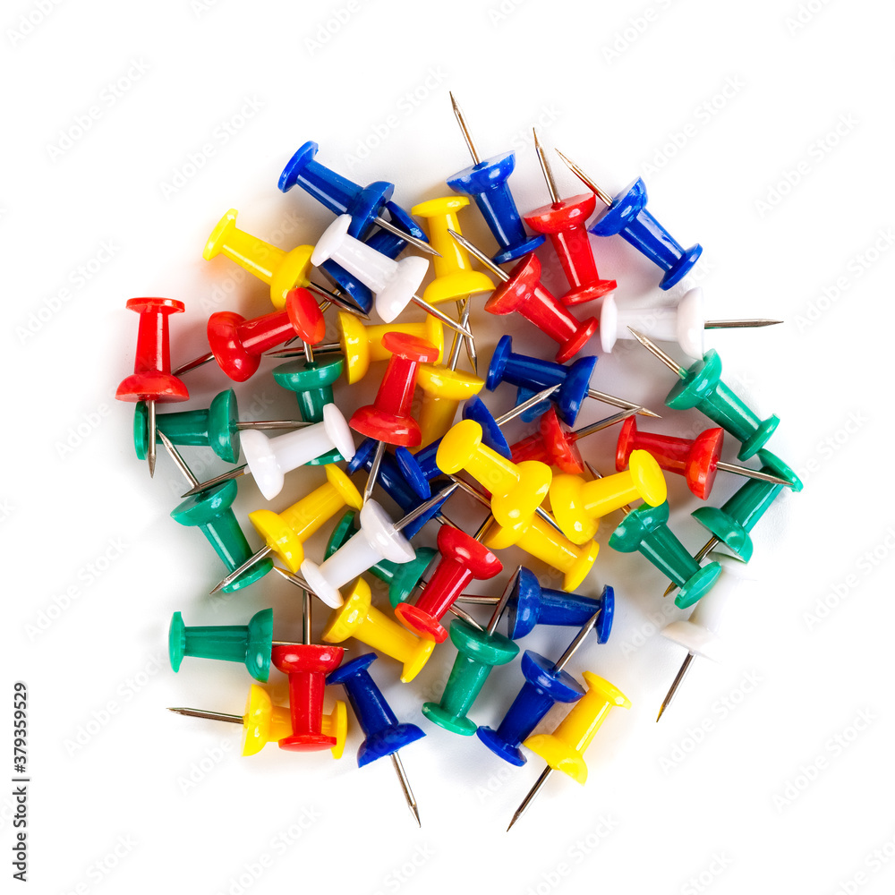 Closeup of Many Colored Thumbtacks on White Closeup of Many Colored Thumbtacks on White