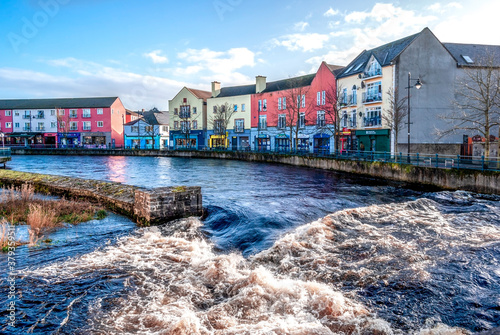 View of Sligo, in county Sligo, Ireland, from Hyde Bridge over the Garavogue (or Garvoge) river, looking at the colorful façades of Rockwood Parade.  photo