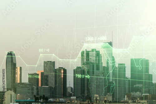 Multi exposure of stats data illustration on Los Angeles city skyline background  computing and analytics concept