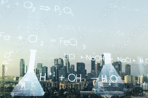 Double exposure of abstract virtual chemistry hologram on Los Angeles city skyscrapers background, research and development concept
