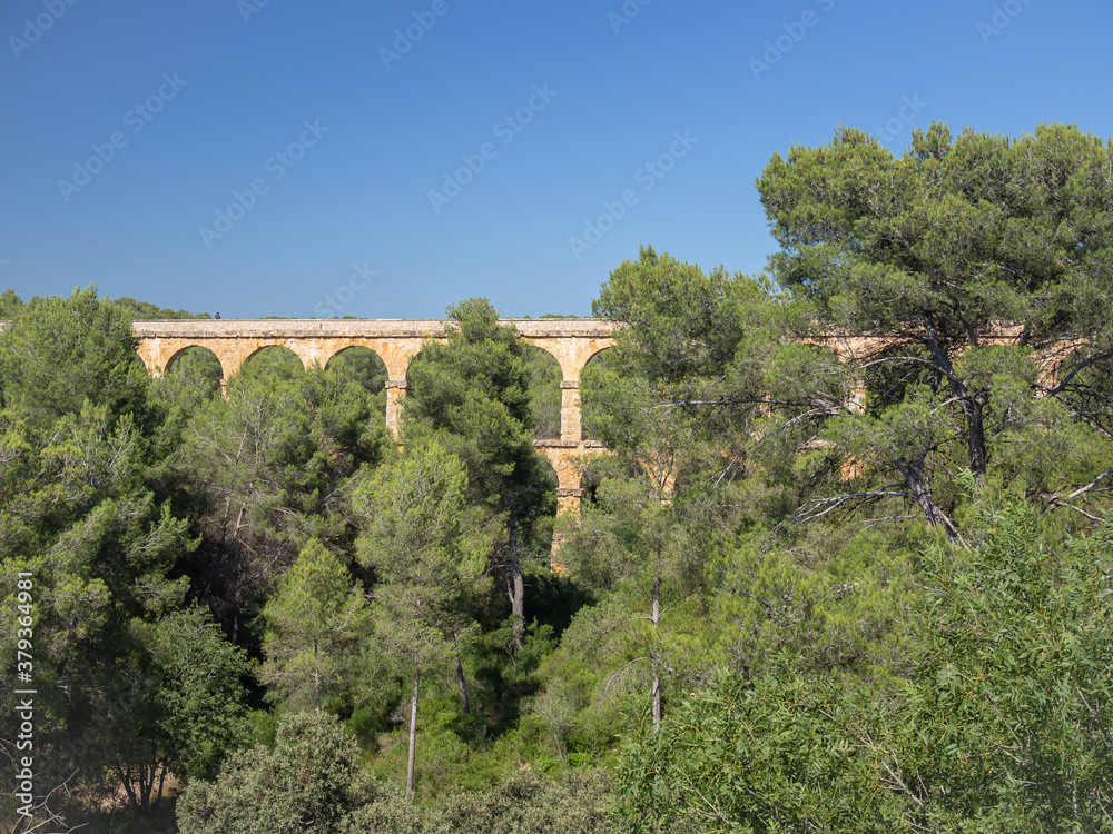 Antique Roman aqueduct known as El Pont del Diable (The devil's bridge), Tarragona, Catalonia, Spain.