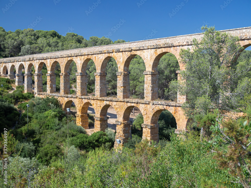 Antique Roman aqueduct known as El Pont del Diable (The devil's bridge), Tarragona, Catalonia, Spain.