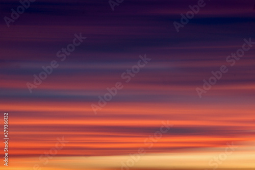 red sunset, dreamlike sky with strange horizontal clouds  © angelo.gi