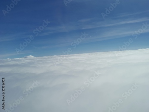 sky, clouds, cloud, blue, above, nature, fly, view, air, weather, white, heaven, aerial, cloudscape, cloudy, atmosphere, space, landscape, high, beautiful, flight, day, travel, beauty, clear © WaiP