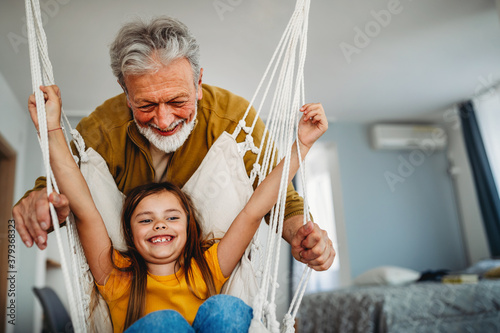 Happy grandparent playing, having fun with grandchildren photo