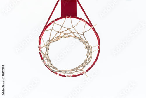 Basketball hoop with white sky in horizontal position. View taken from below.