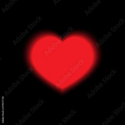 Red glowing heart on a black background