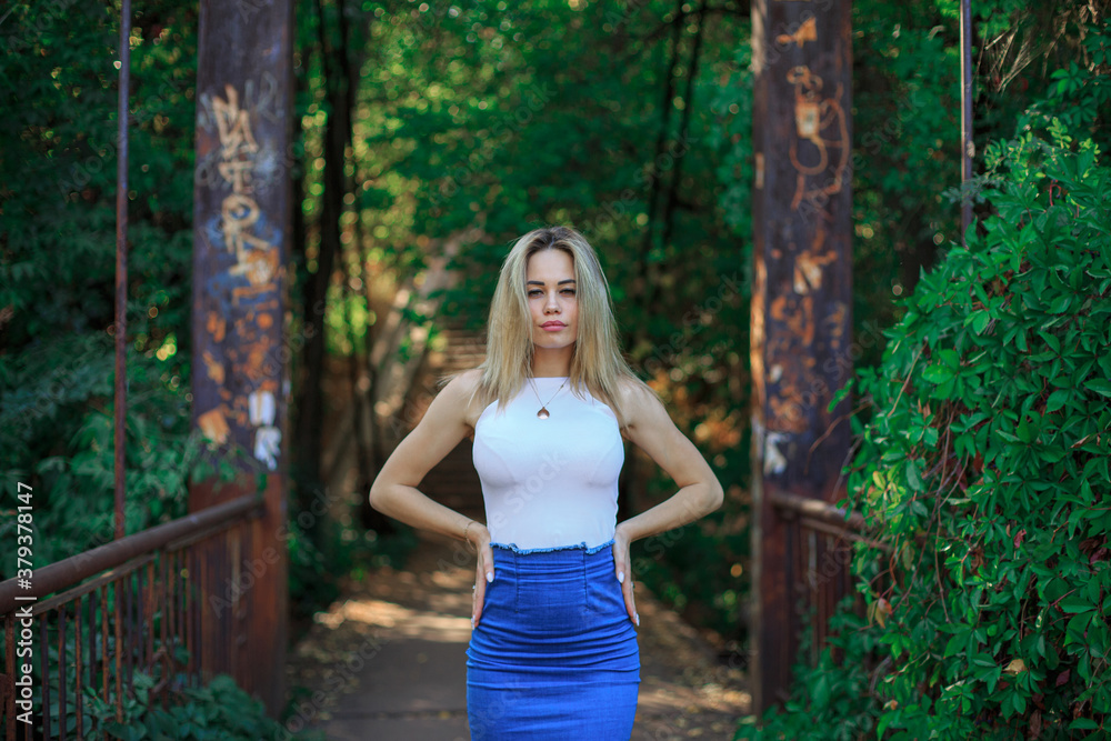 Portrait of a young woman in the park Portrait of a young woman in the park