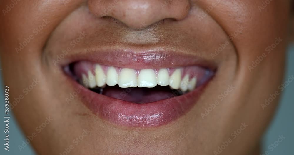 Happy mixed race young woman close-up mouth smiling Happy mixed race young woman close-up mouth smiling