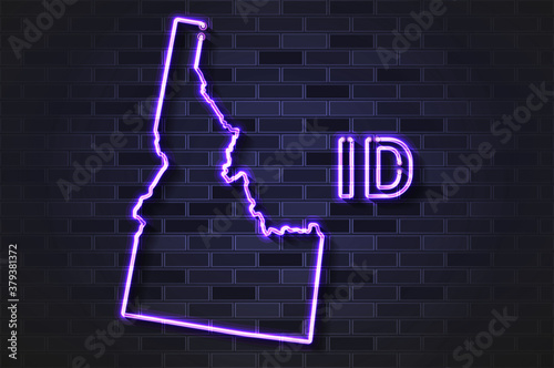 Idaho map glowing neon lamp or glass tube on a black brick wall
