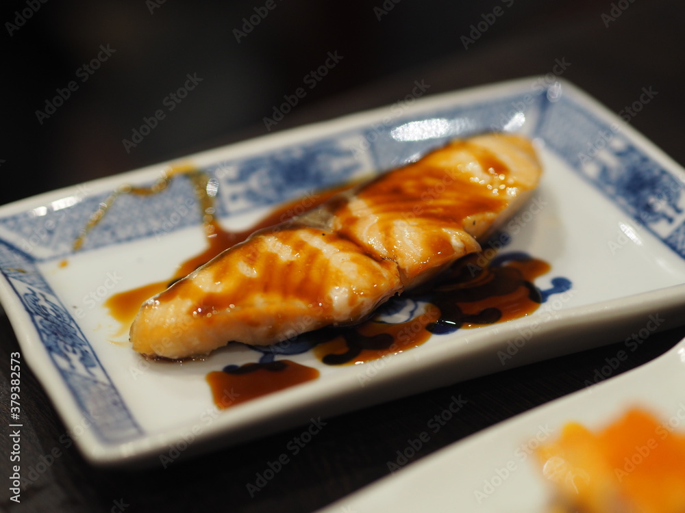 torched Salmon Aburi Saikyo Sushi with sweet sauce on white plate, Japanese food torched Salmon Aburi Saikyo Sushi with sweet sauce on white plate, Japanese food