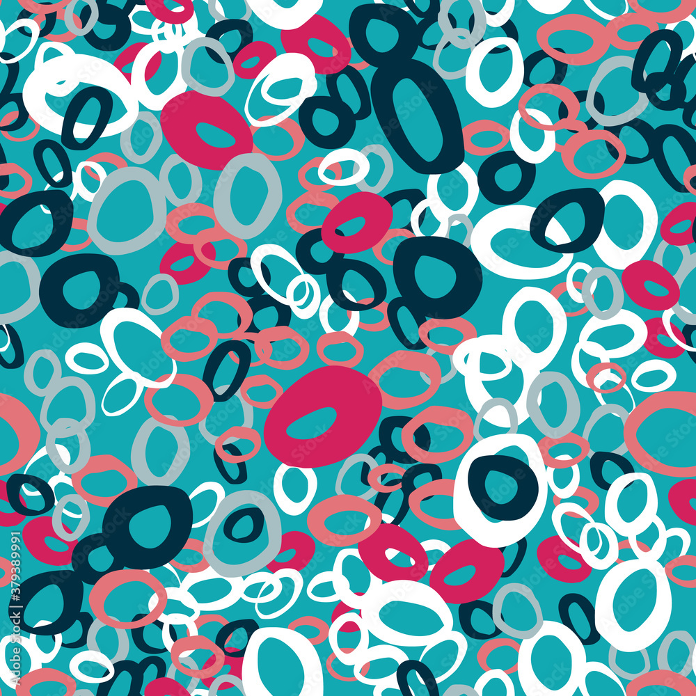 Random bright seamless pattern with rings silhouettes. Pink, white and navy blue colored circle shapes on blue background.