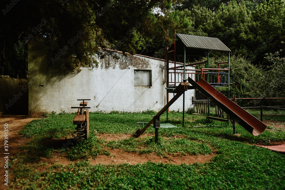 playground in the garden. old abandoned playground in the middle of the forest