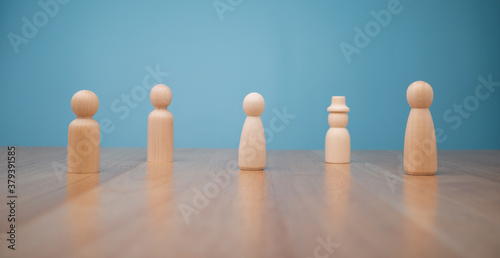 Many wooden human figures  Man and woman standing. Concept of Human resource  Talent management  Recruitment employee