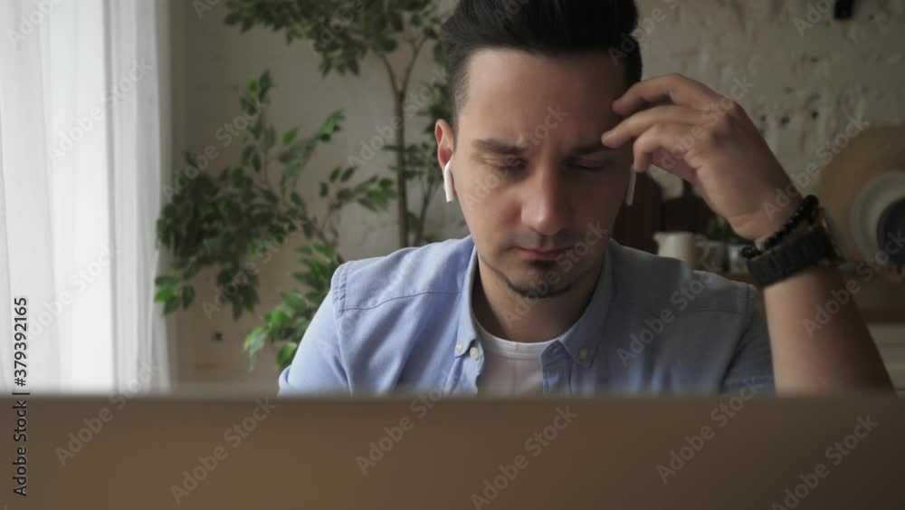Casual concentrated entrepreneur developing new project while working on laptop Casual concentrated entrepreneur developing new project while working on laptop