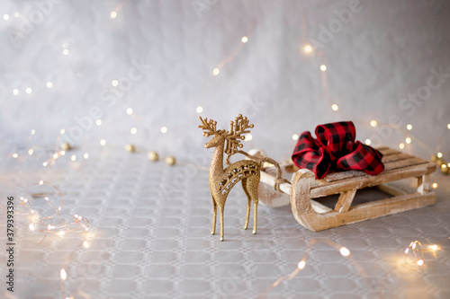 christmas background with golden deer and sleigh